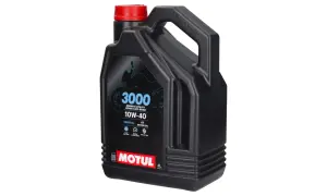 Czarny kanister oleju Motul 3000 10W-40, idealny jako olej do crossa 4t, zapewnia ochronę silnika i łatwą zmianę biegów.