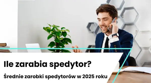 Uśmiechnięty mężczyzna w garniturze rozmawia przez telefon w nowoczesnym biurze.